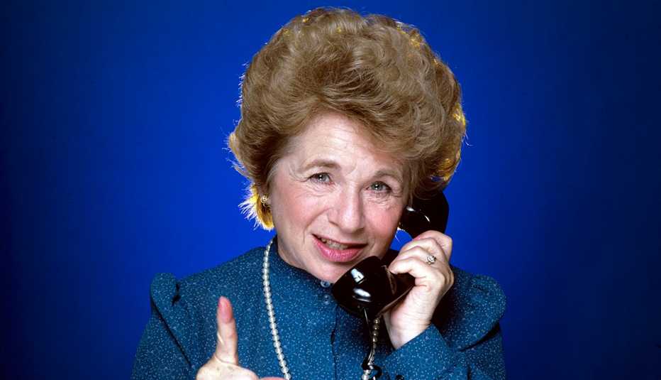 Doctor Ruth talks on a phone Doctor Ruth talks on a phone