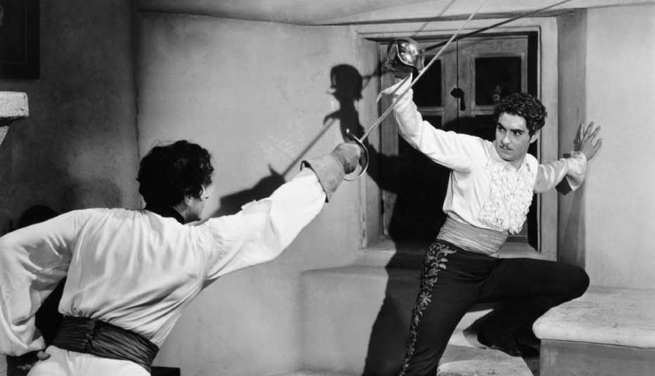 tyrone power in a fighting scene from the film the mark of zorro