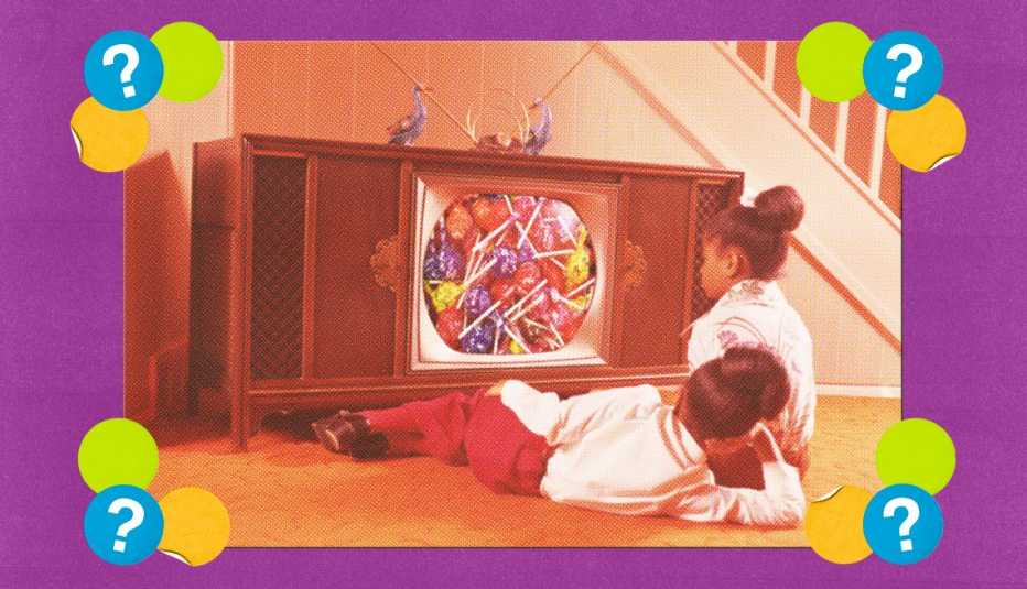 two kids watching a television