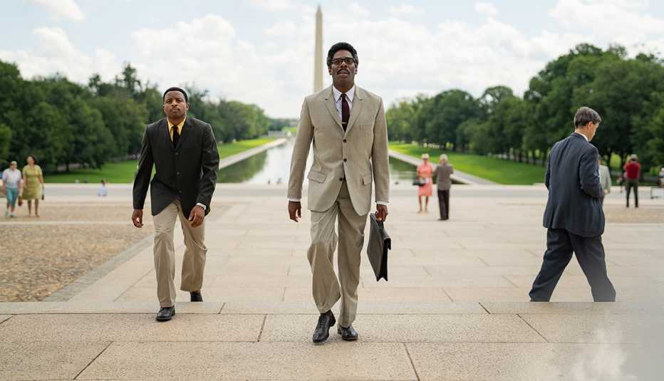 colman domingo walking with aml ameen at the Lincoln Memorial steps with the Washington Monument and Reflecting Pool in the background in a scene from the film rustin