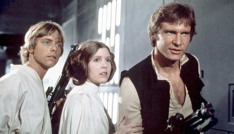 Mark hamill Carrie Fisher and Harrison Ford in a scene from Star Wars Episode 4 A New Hope Mark hamill Carrie Fisher and Harrison Ford in a scene from Star Wars Episode 4 A New Hope
