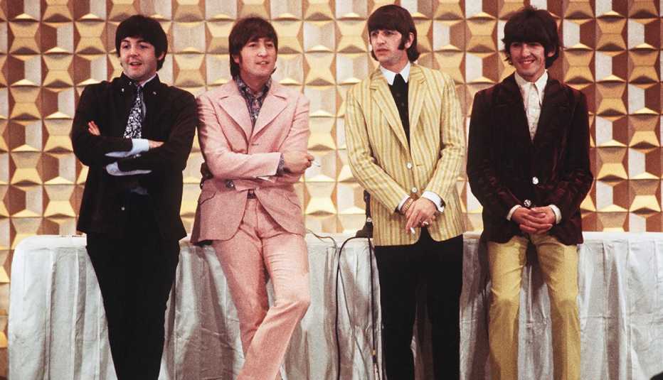 paul mccartney john lennon ringo starr and george harrison at a press conference for the start of their tour in tokyo japan in 1966