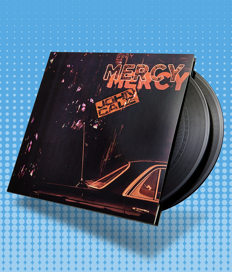 album cover with record sticking out of it; cover says mercy, john cale with side view of back of car; blue background with little shapes on it