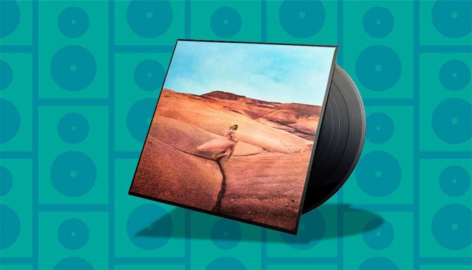 Music album cover with record sticking out of it; person in desert on cover music album cover with record sticking out of it; person in desert on cover