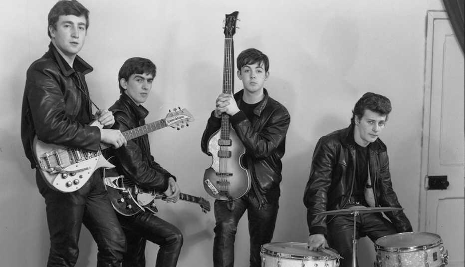 john lennon george harrison paul mccartney and pete best pose for a photo session in 1961