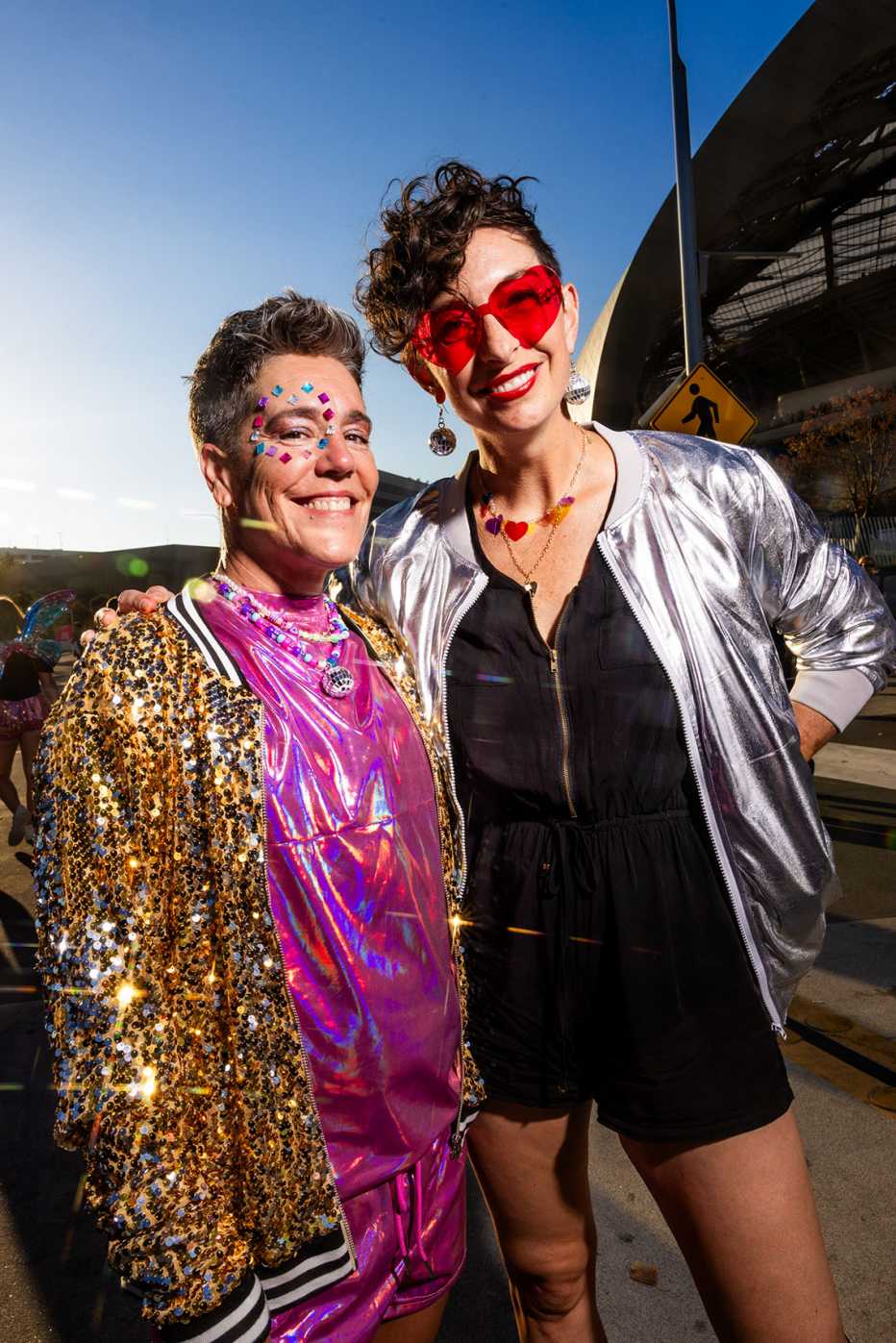 married couple michelle and rebecca skoor outside of sofi stadium in los angeles california