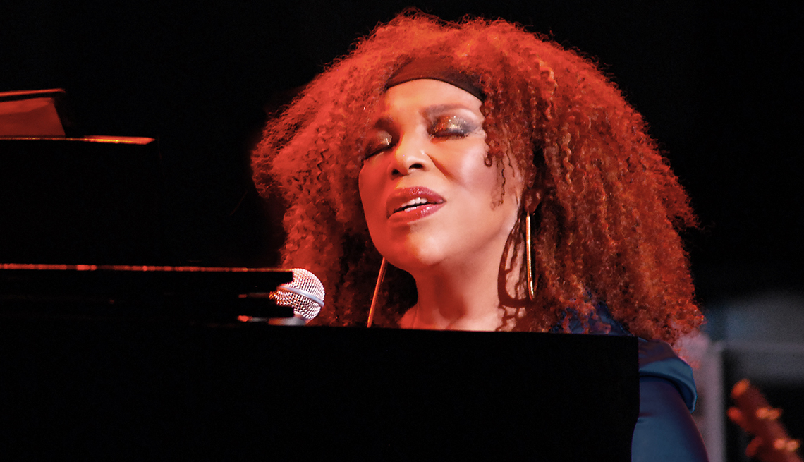 Roberta Flack singing while playing the piano