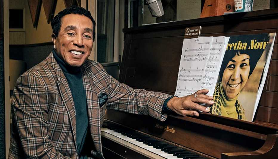 Smokey Robinson sitting in front of a piano Smokey Robinson sitting in front of a piano