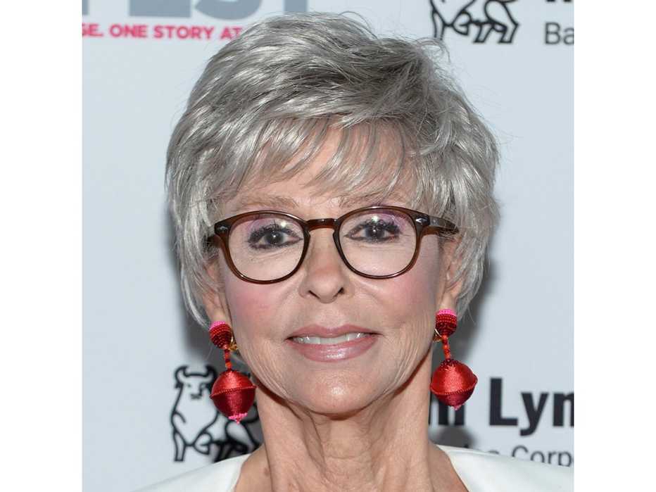 Rita Moreno in large classic tortoiseshell frames. Rita Moreno in large classic tortoiseshell frames.