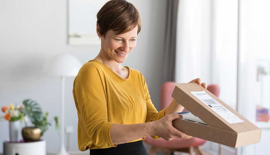 woman looking inside a box woman looking inside a box