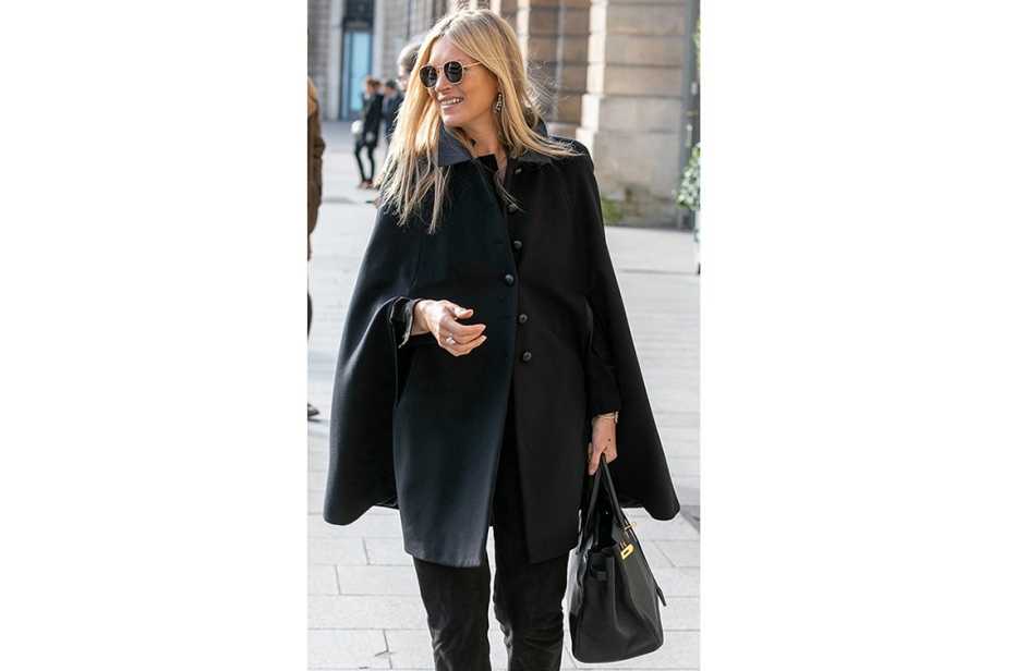 Kate Moss hand-carries a round-handled satchel.