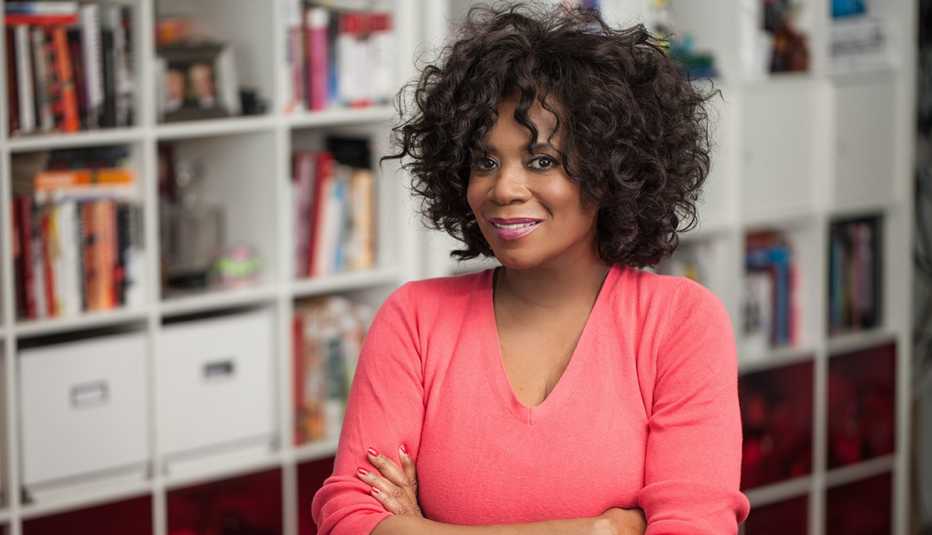 A woman wearing a pink v neck shirt