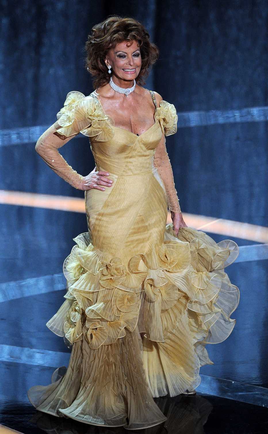 Sophia Loren wearing a yellow gold dress at the 81st Annual Academy Awards