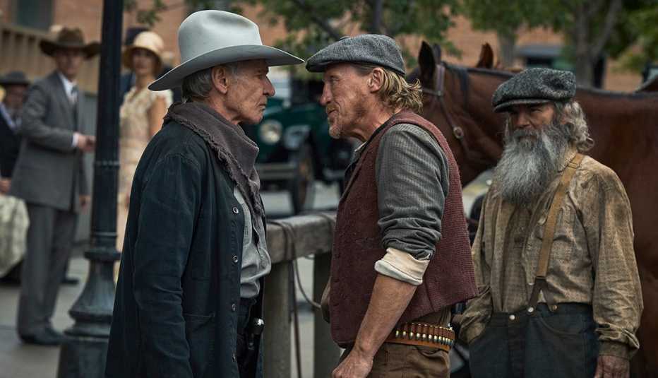 Harrison Ford and Jerome Flynn have a staredown in front of each other in the television series 1923 Harrison Ford and Jerome Flynn have a staredown in front of each other in the television series 1923