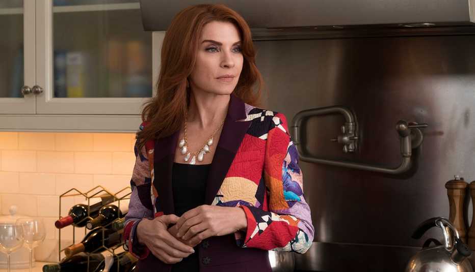 Julianna Margulies standing in a kitchen.