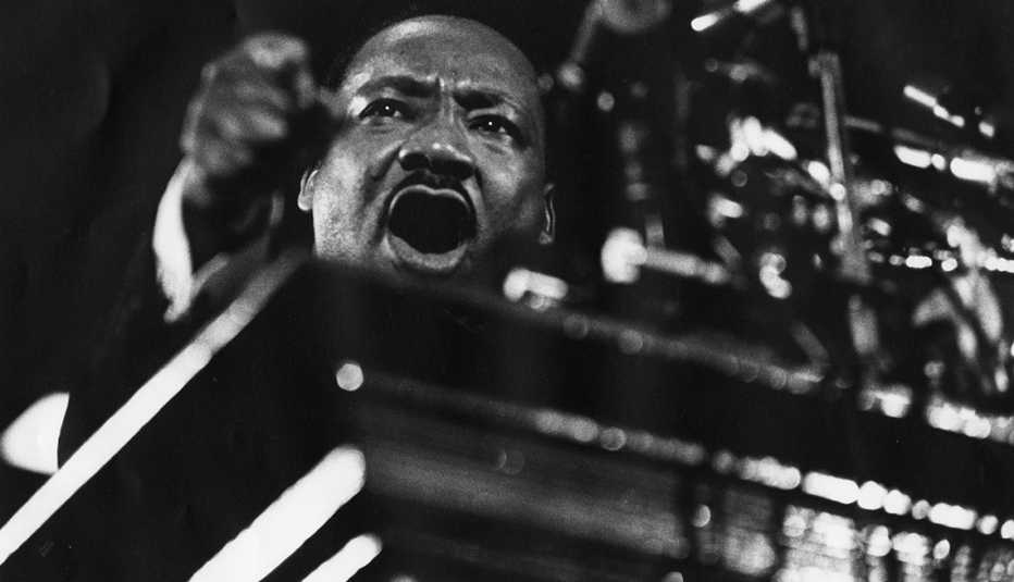 Martin Luther King Jr. standing at a podium