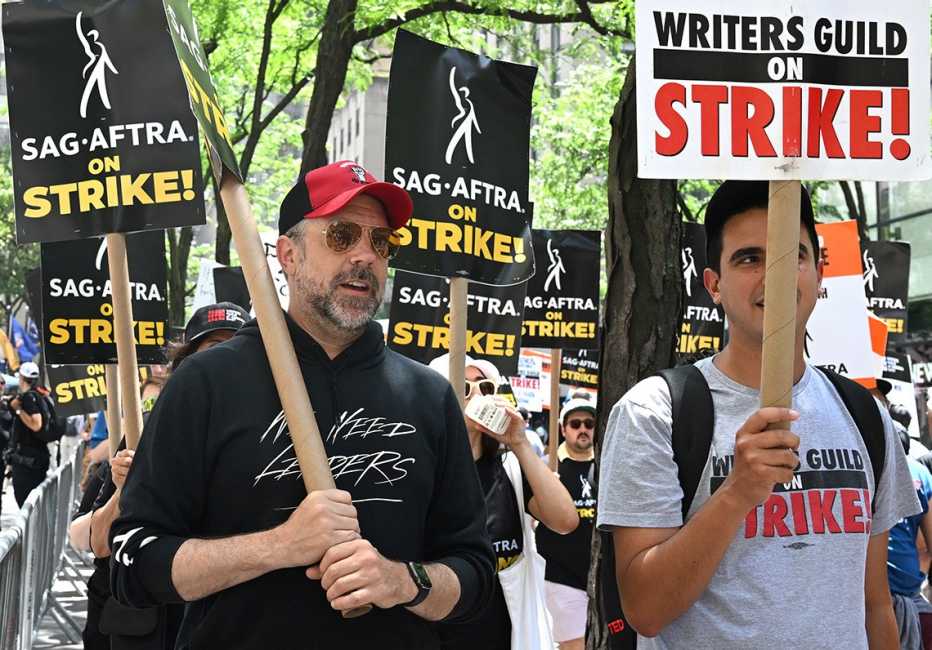 "Ted Lasso" star Jason Sudeikis pickets with members of the Writers Guild of America and the Screen Actors Guild outside NBC Universal in New York City. actor jason sudeikis pickets with members of the writers guild of america and screen actors guild outside nbc universal in new york city