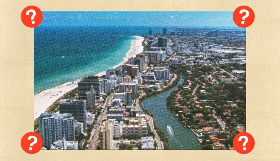 Buildings along sand and ocean; surrounded by red circles with question marks in them