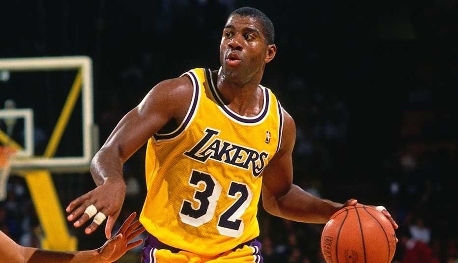 Magic Johnson dribbling a basketball during an NBA game in 1991