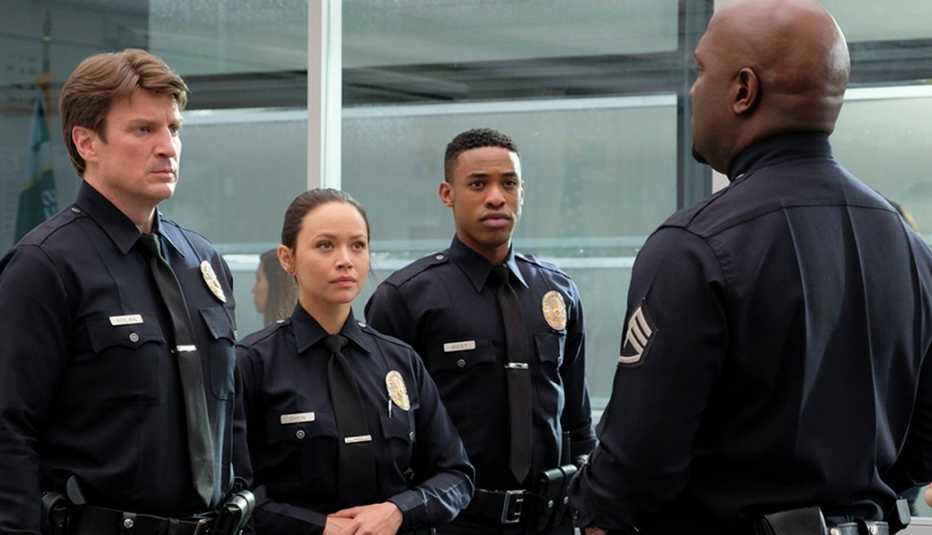 Nathan Fillion, Melissa O'Neil, Titus Makin, Richard T. Jones in "The Rookie"