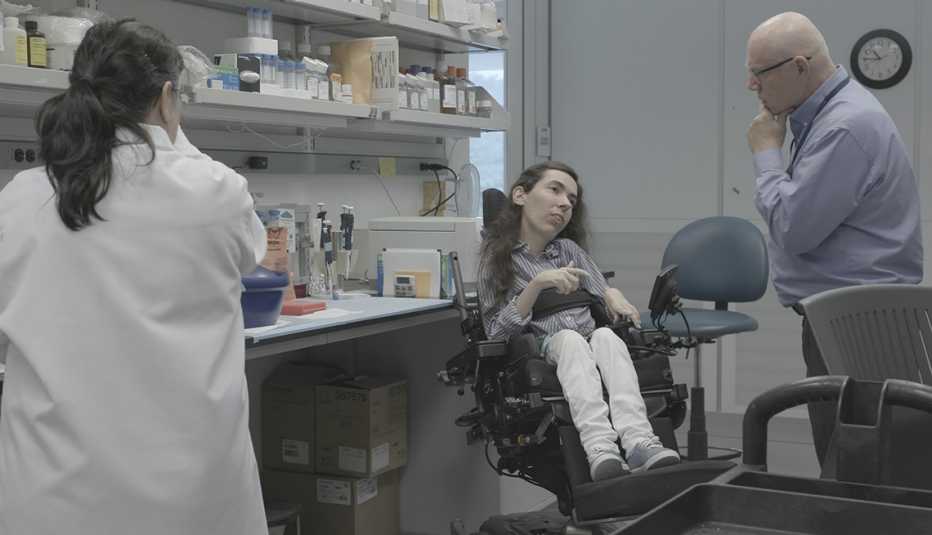 Audrey Winkelsas discusses her experiments with the lab manager at the National Institutes of Health. Audrey Winkelsas discusses her experiments with the lab manager at the National Institutes of Health.