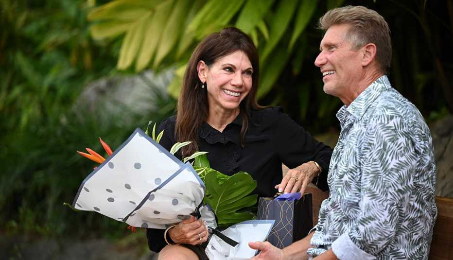 Theresa holds a bouquet of flowers sitting next to Gerry Turner on the finale of "The Golden Bachelor."