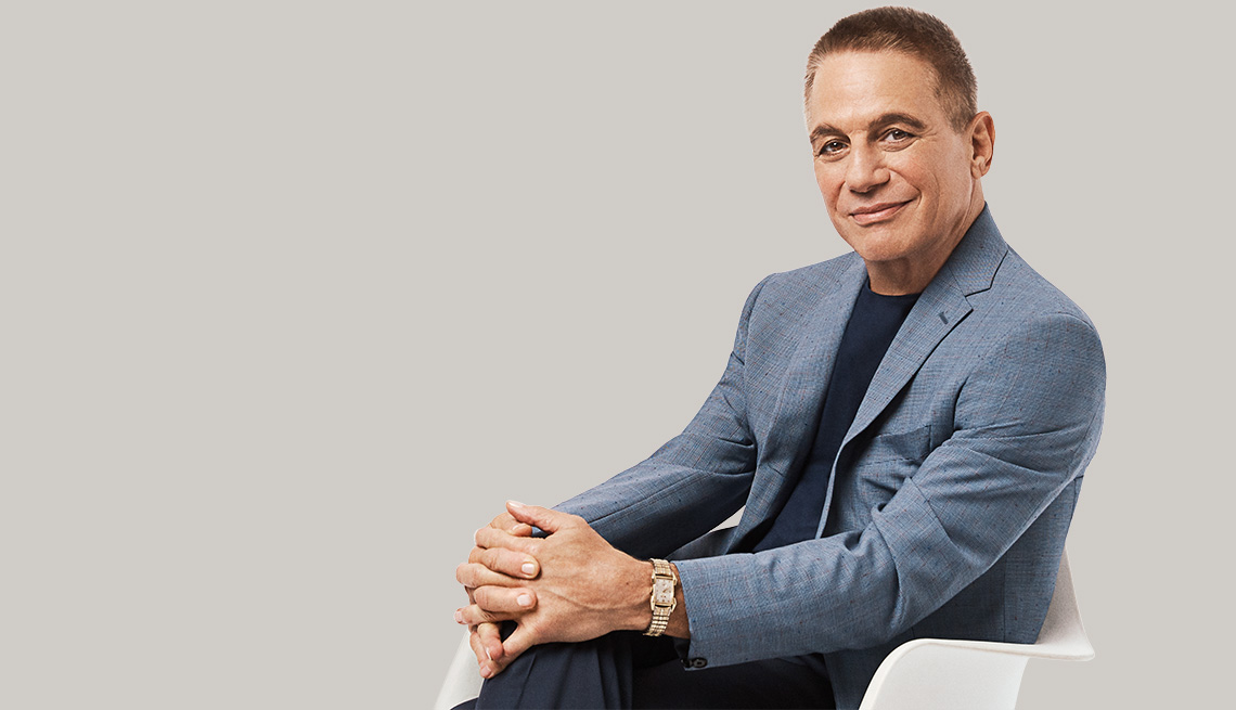 Tony Danza sitting in a chair.