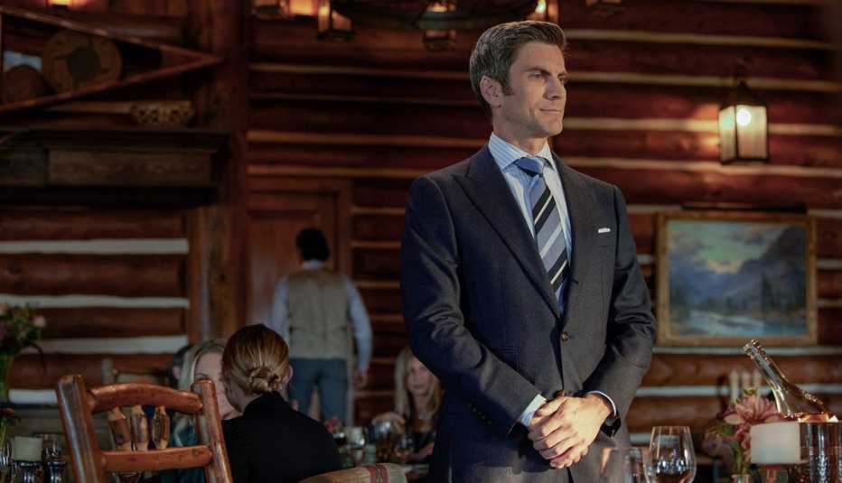 Wes Bentley looking into the distance while wearing a suit in Yellowstone