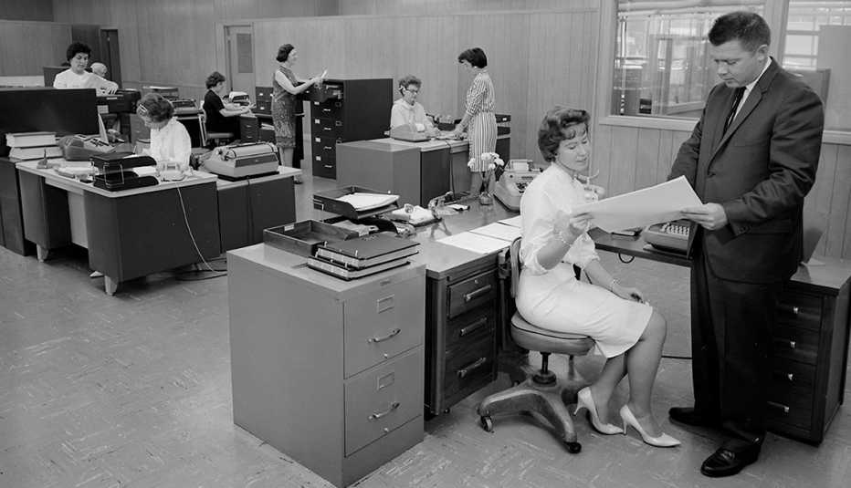 a male manager discusses a project with a female worker