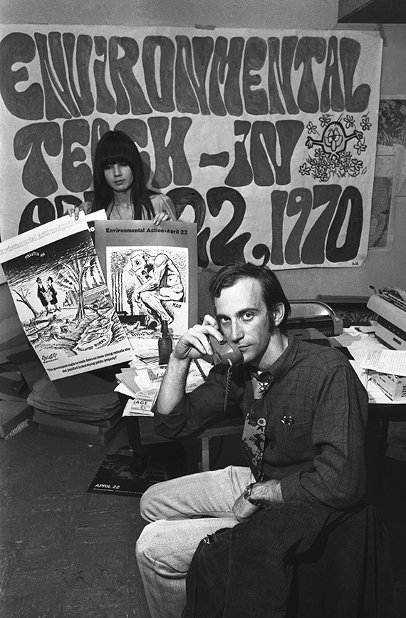nineteen seventy black and white photo of denis hayes on the phone organizing earth day from his office