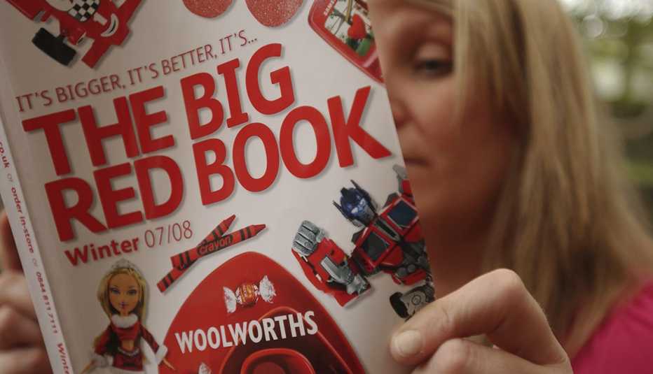 A woman looking at a catalog
