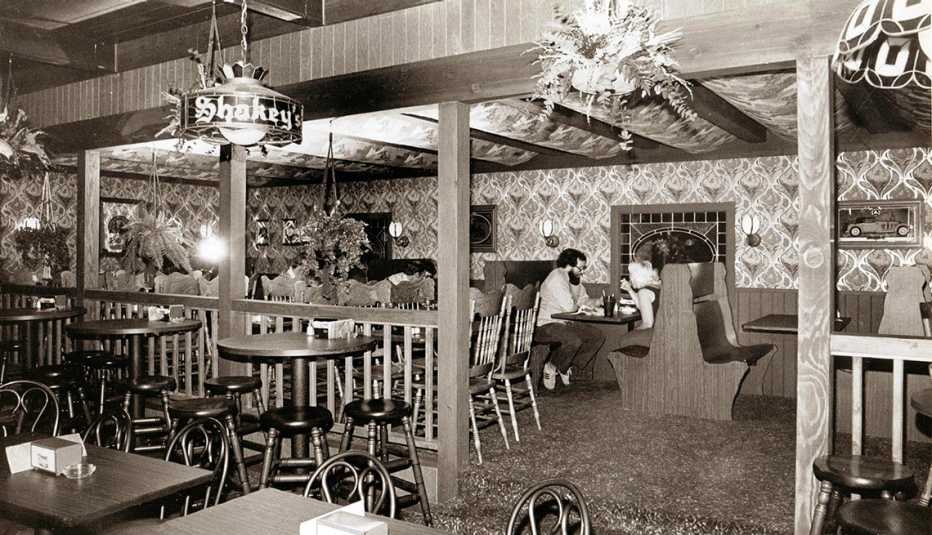 black and white photo of a restaurant interior taken in nineteen sixty eight a shakeys pizza interior