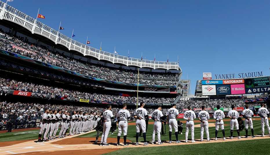 baseball players at yankee stadium on a sunny day