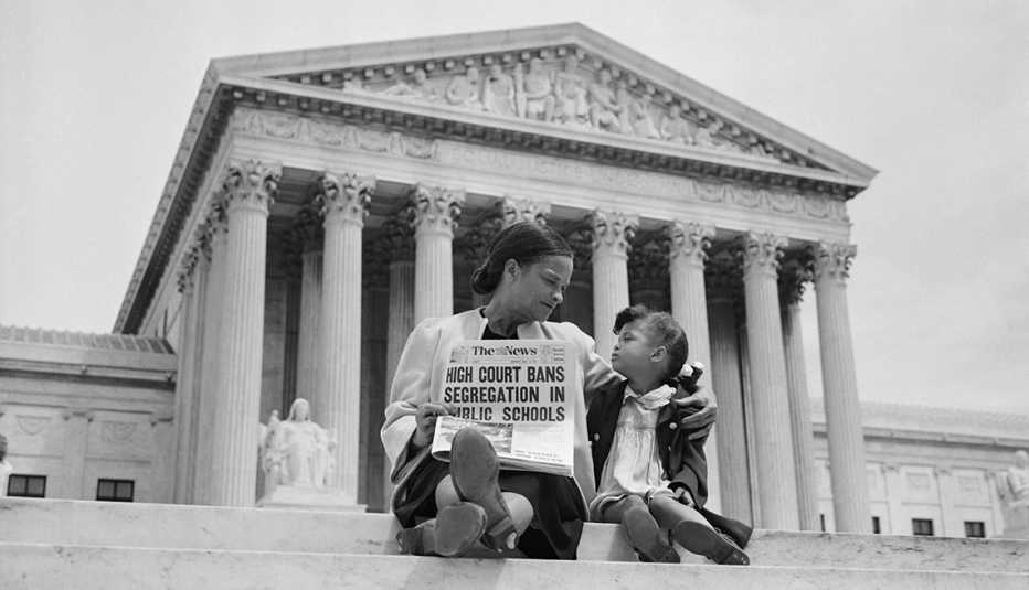 A woman talks to her daughter in front of the Supreme Court