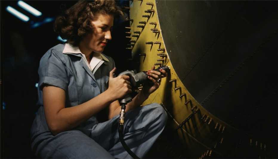 A riveter at work on a Consolidated bomber in October 1942 at Consolidated Aircraft Corp. in Fort Worth, Texas. A riveter at work on a Consolidated bomber in October 1942 at Consolidated Aircraft Corp. in Fort Worth, Texas.
