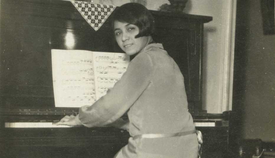 Clotilde Arias sitting at the piano in her Brooklyn, New York apartment Clotilde Arias sitting at the piano in her Brooklyn, New York apartment