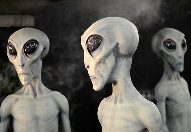 what we believe skeptical aliens ufo heaven hell zombies angels reincarnation ghosts astrology bigfoot apocalypse vampires poll stats belief alien heads (Corbis)