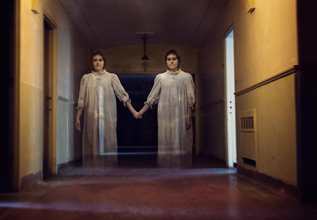what we believe skeptical aliens ufo heaven hell zombies angels reincarnation ghosts astrology bigfoot apocalypse vampires poll stats belief ghost girls hallway (Flickr RM/Getty Images)