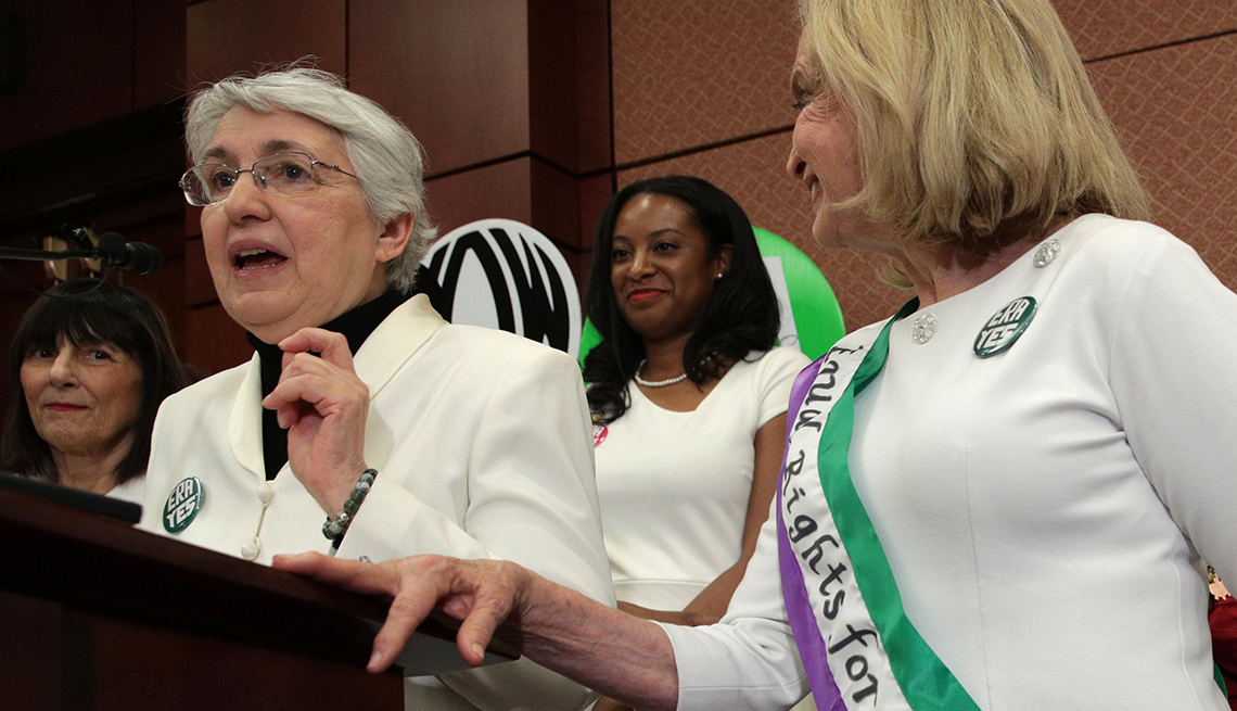 Women speaking at a press conference