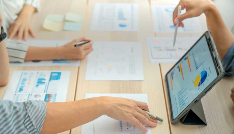 Image of people looking at spreadsheets