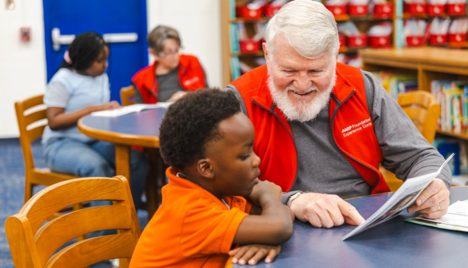 Experience Corps senior tutor, Randy Hardin with student, Timothy Lettbetter and in the foreground senior tutor, Nita Hardin with student, Jamiyah Williams in Macon-GA
