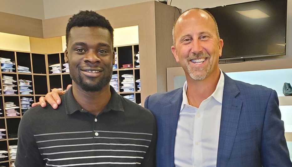 Impressed by Michael Phillips (left), who lived out of his car to save money and pay for his real estate license, Scot Johnston bought him a more professional wardrobe.