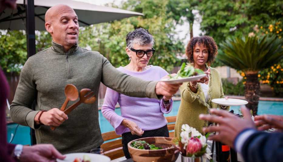 people enjoying a dinner party outside