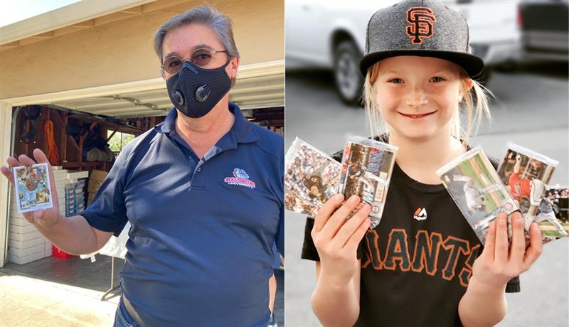 A man and a young girl hold up baseball cards