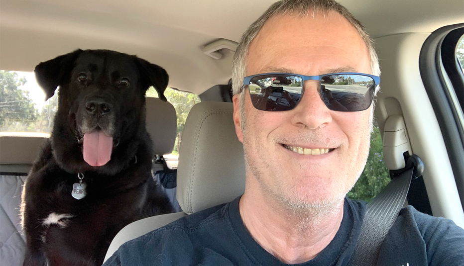 neil zevnik driving with his dog pearl