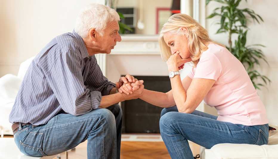 A man consoling a woman during a discussion