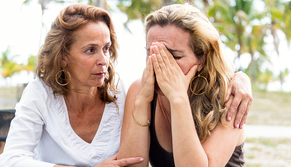 Woman being comforted by her friend