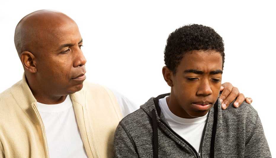 Father talking with his teenage son.