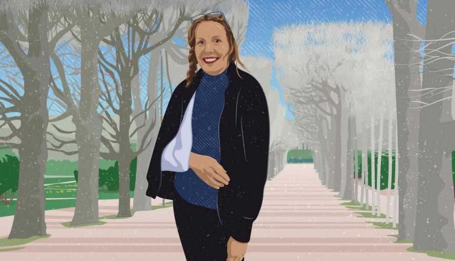 Travel writer Hilary Nangle with one arm in a sling poses on a foot path between rows of trees