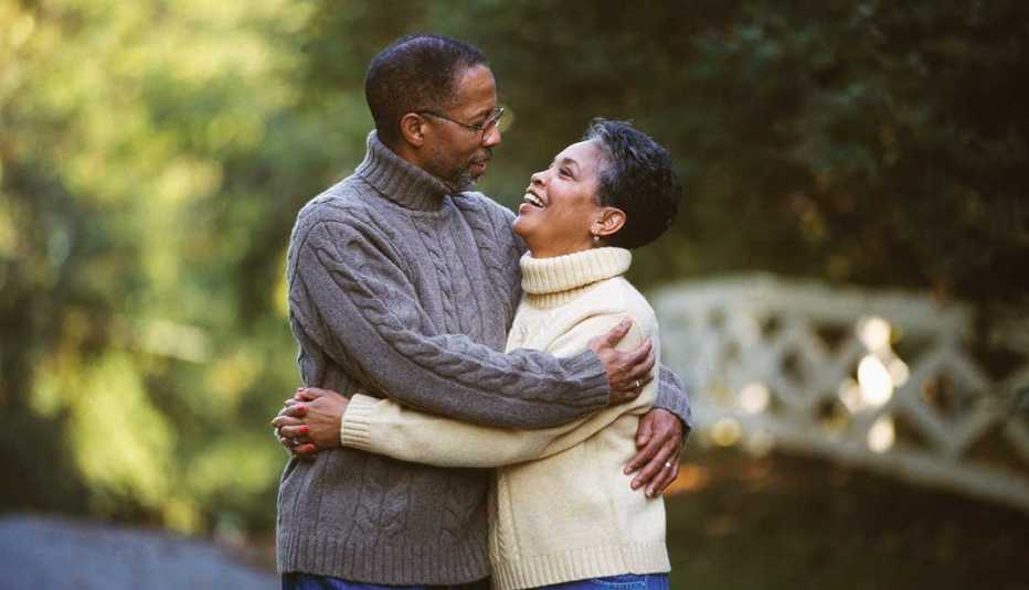 a mature couple hugging 